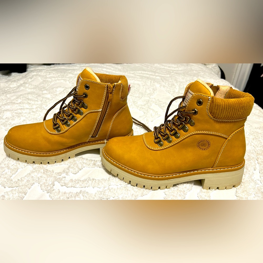 Tan winter boots. Worn once! Size 8.5